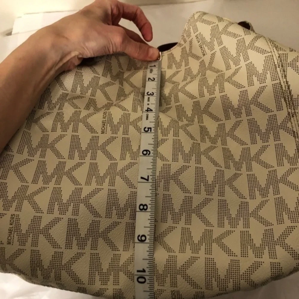 Michael kors white monogram triple compartment bag